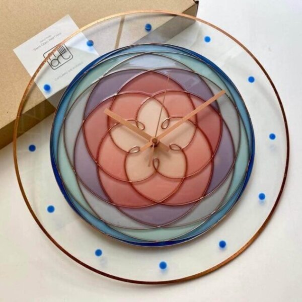 The Path of Venus clock is a sacred geometric double-sided drawing on glass. Handmade wall clock by Milliart.
